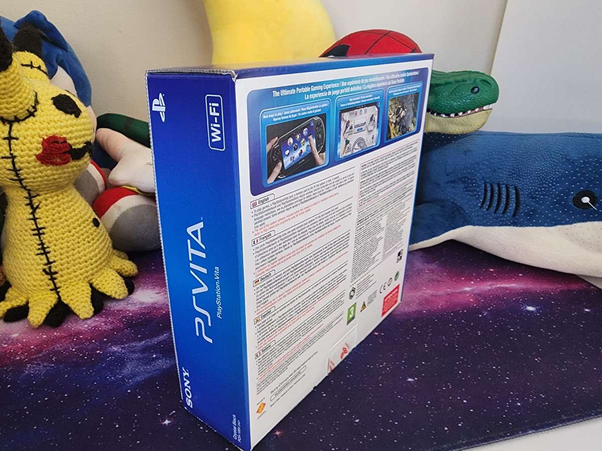 PS VITA WIFI OLED, 2 Games, Original Packaging (Pre-owned)