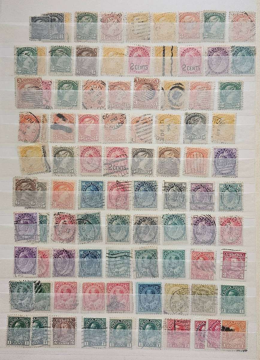 Canada mixed lot on album pages.