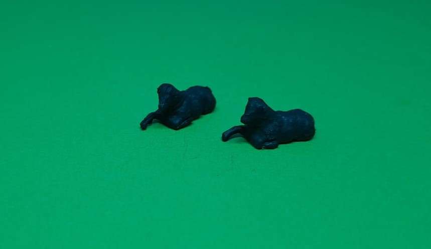 Model Trains HO 1 x Pack of 2 laying black sheep.