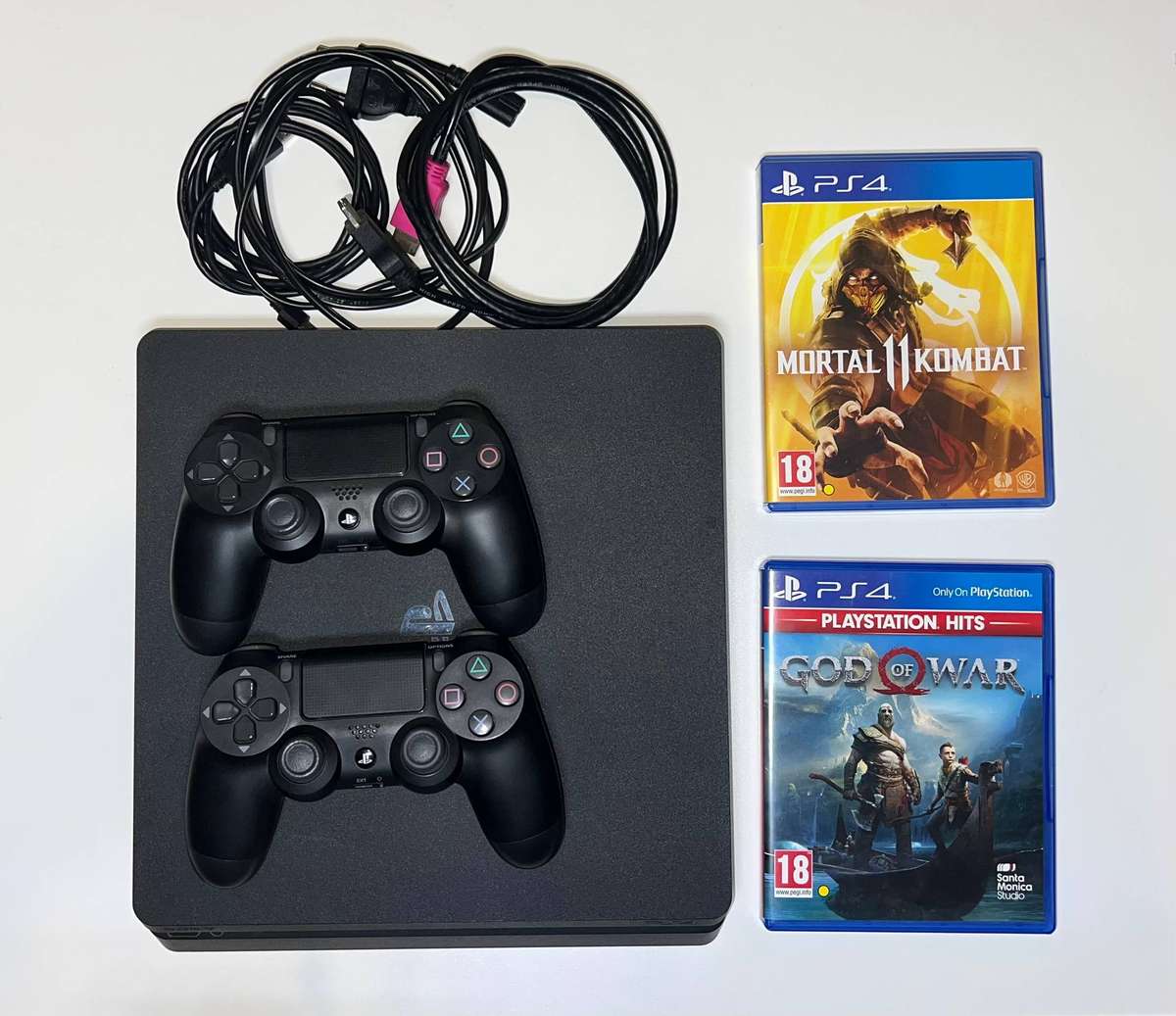PlayStation 4 Slim - 1TB + 2 Controllers + 2 Games
