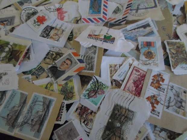 500 X USED STAMPS ON PAPER SEE PICS