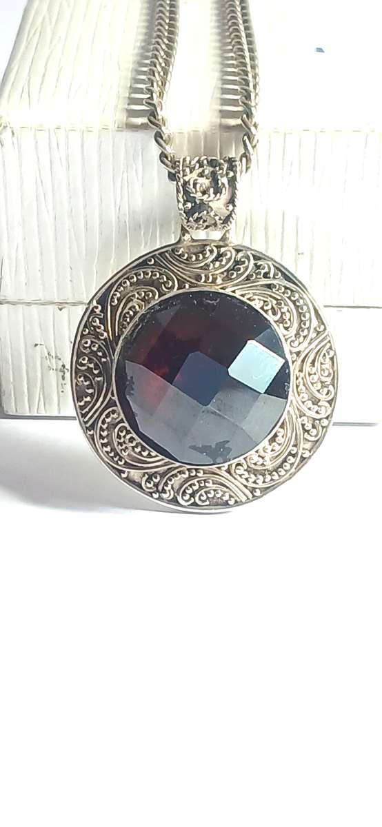 Sterling silver pendant with synthetic red stone