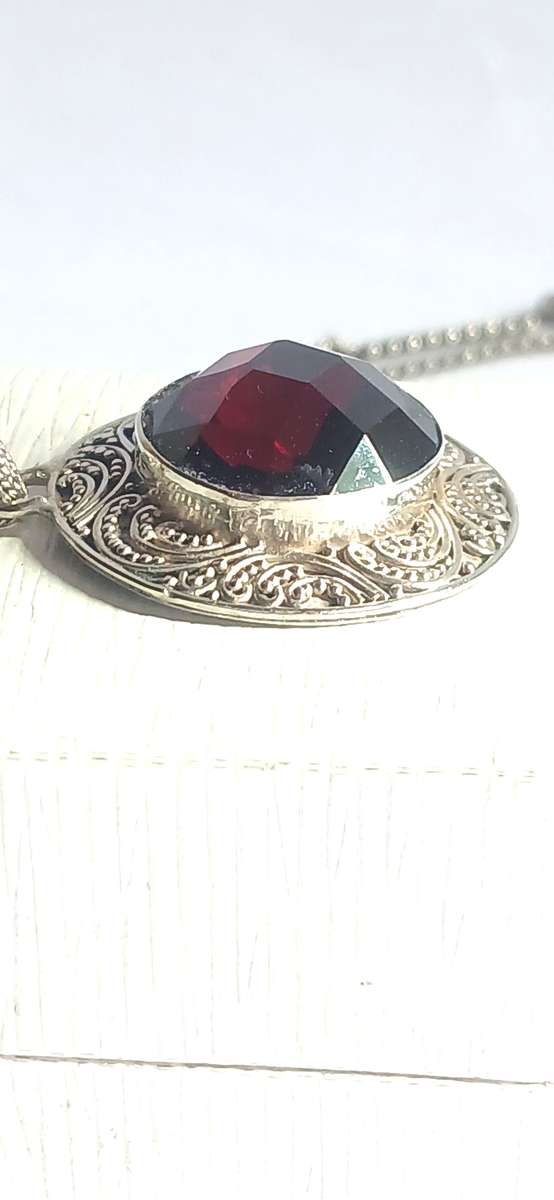 Sterling silver pendant with synthetic red stone