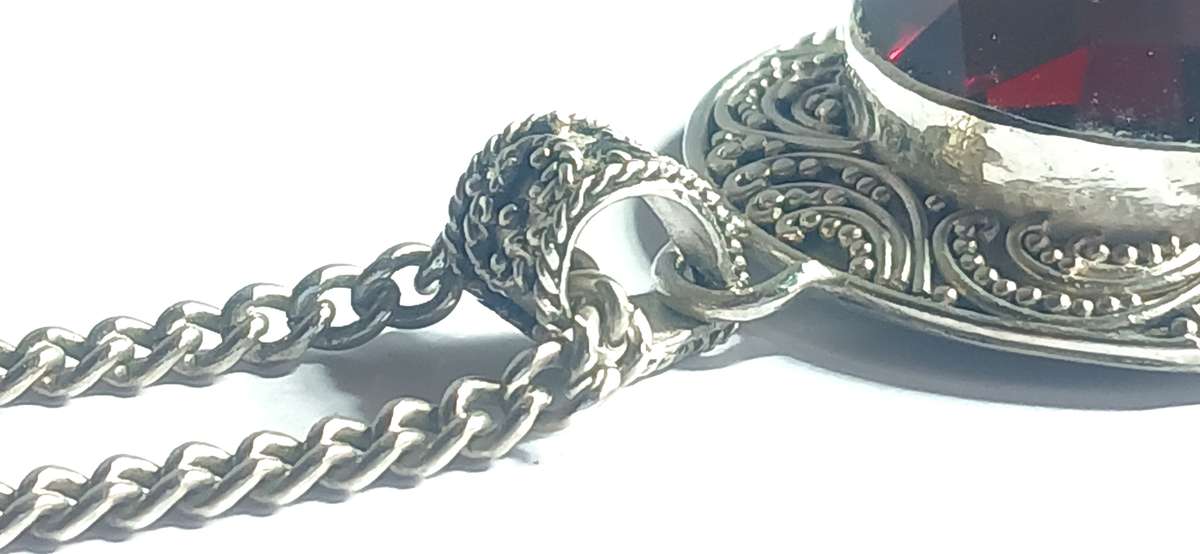 Sterling silver pendant with synthetic red stone