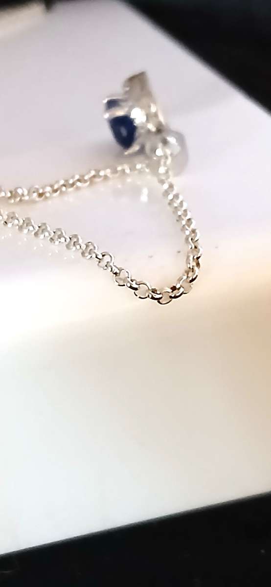 Sterling silver pendant with blue stone on chain