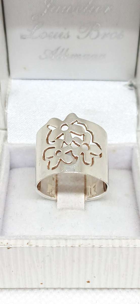 Sterling silver broad floral design ring
