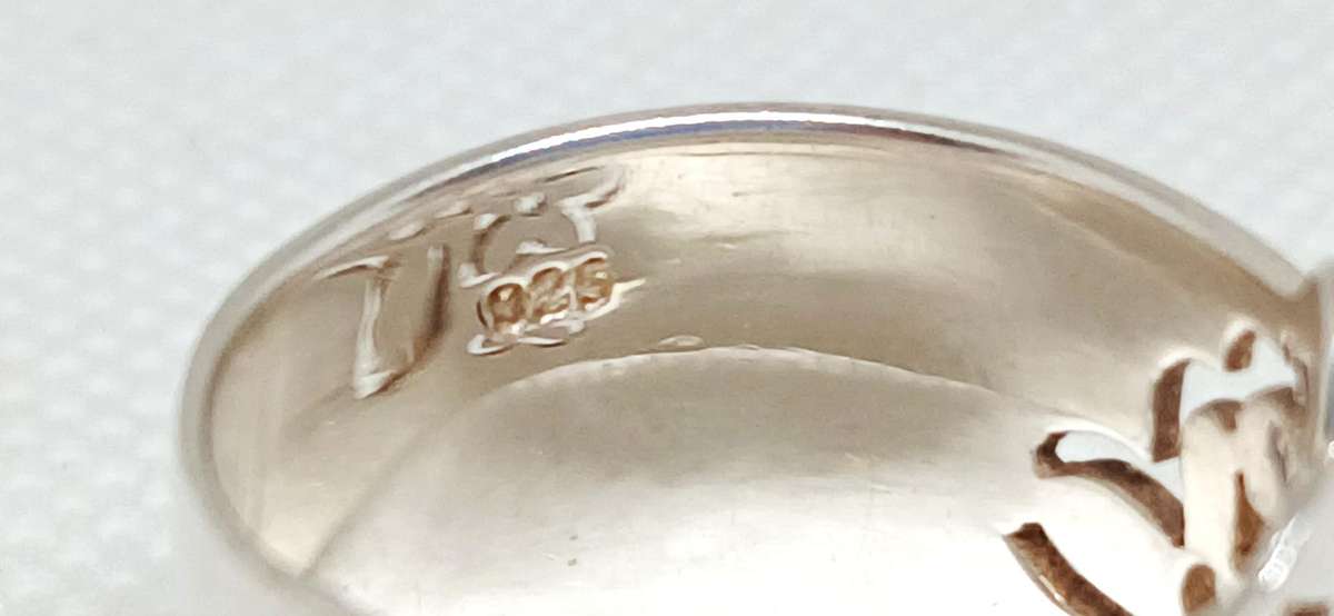 Sterling silver broad floral design ring