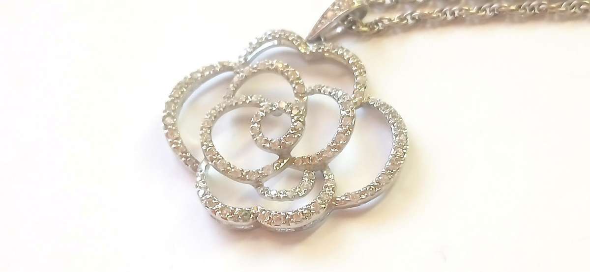 Sterling silver "rose' pendant on chain