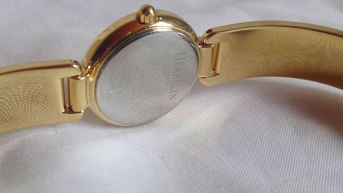 Michel Herbelin gold tone M-Band ladies watch