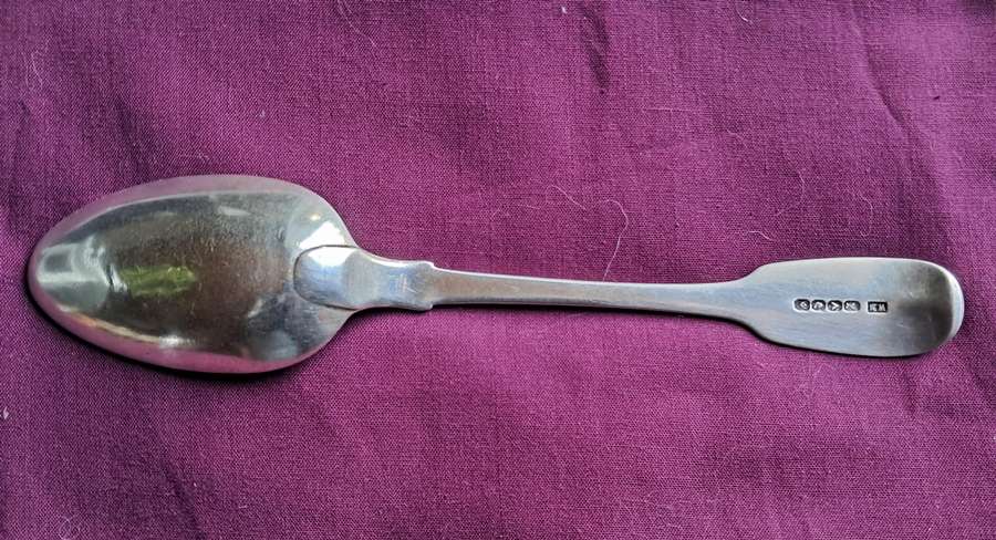 Solid silver dessert spoon by a Cape silversmith