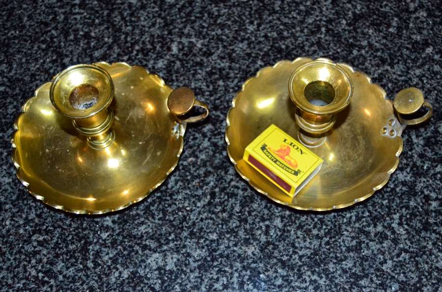 A pair of vintage solid brass candle holders