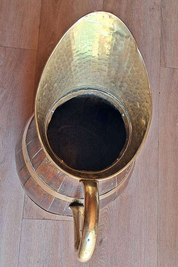 Large antique oak and brass jug