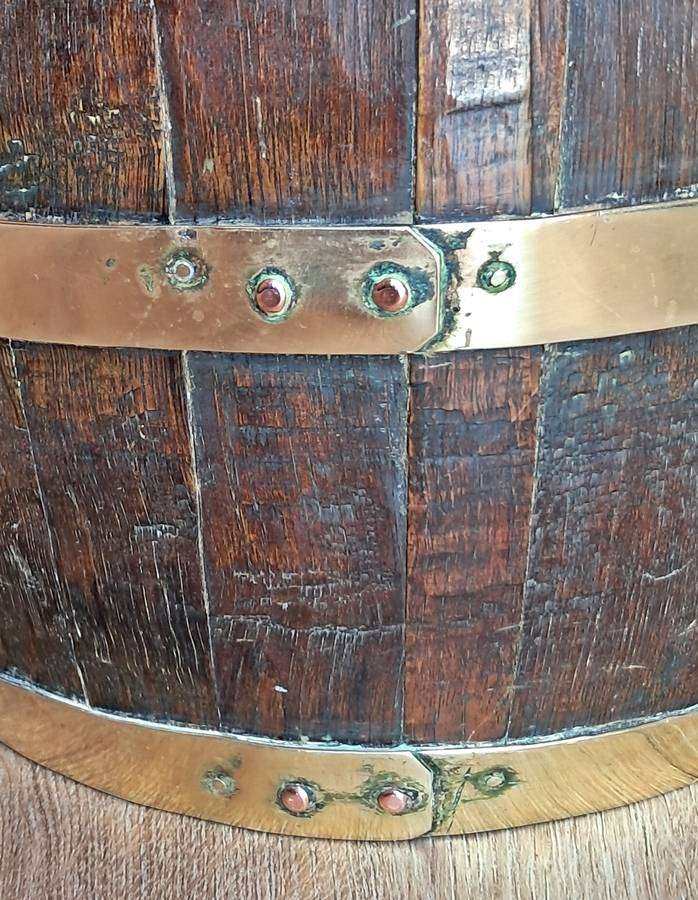 Large antique oak and brass jug