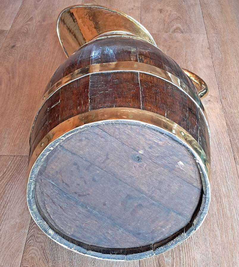 Large antique oak and brass jug