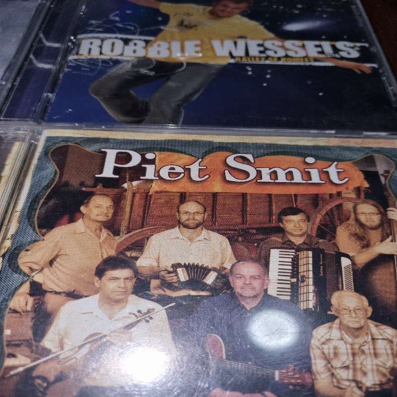 4 x Afrikaanse CD's - Leon Schuster, Klipwerf, Robbie Wessels & Piet Smit