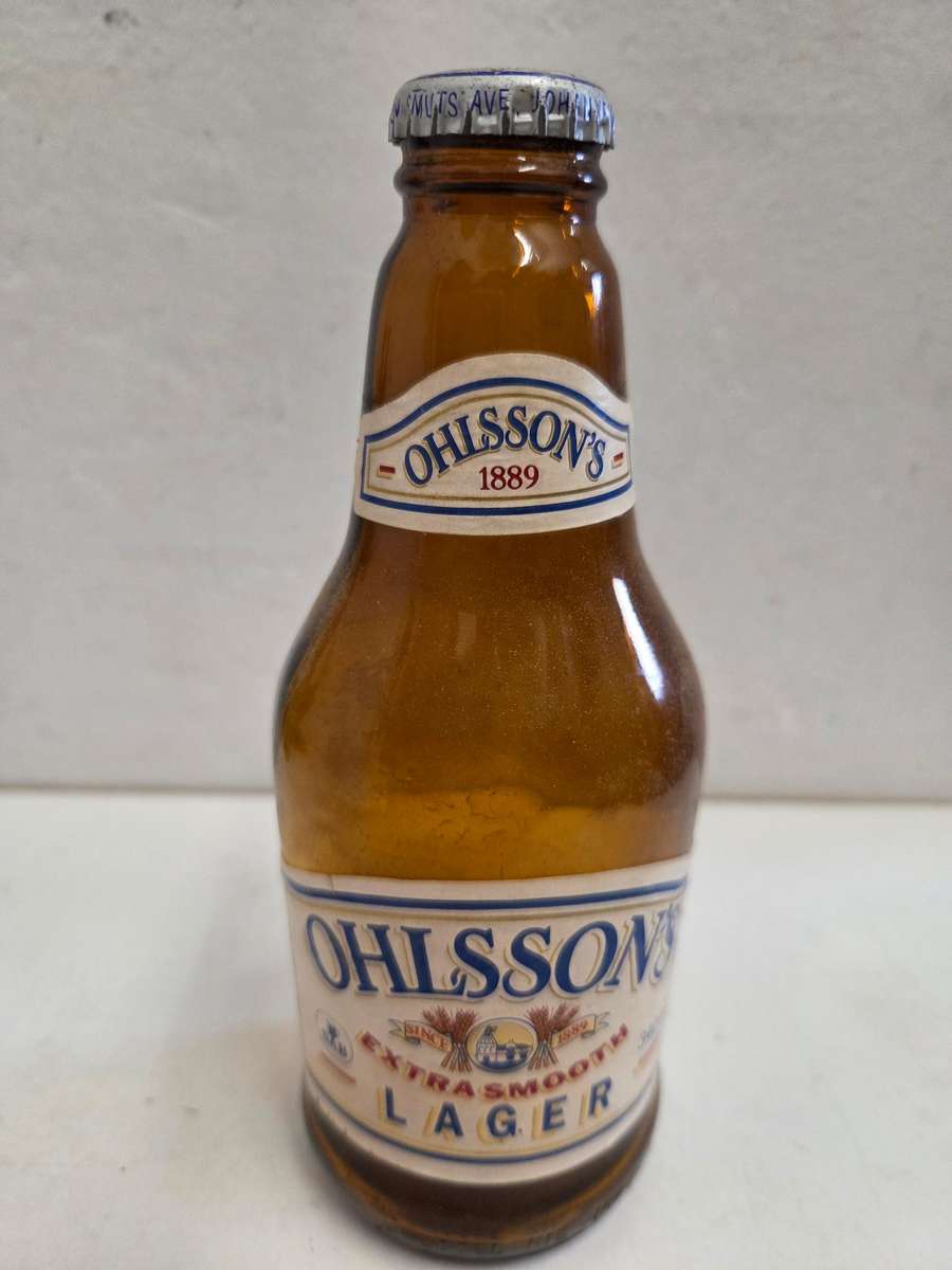 Vintage Ohlsson's Lager bottle with cap