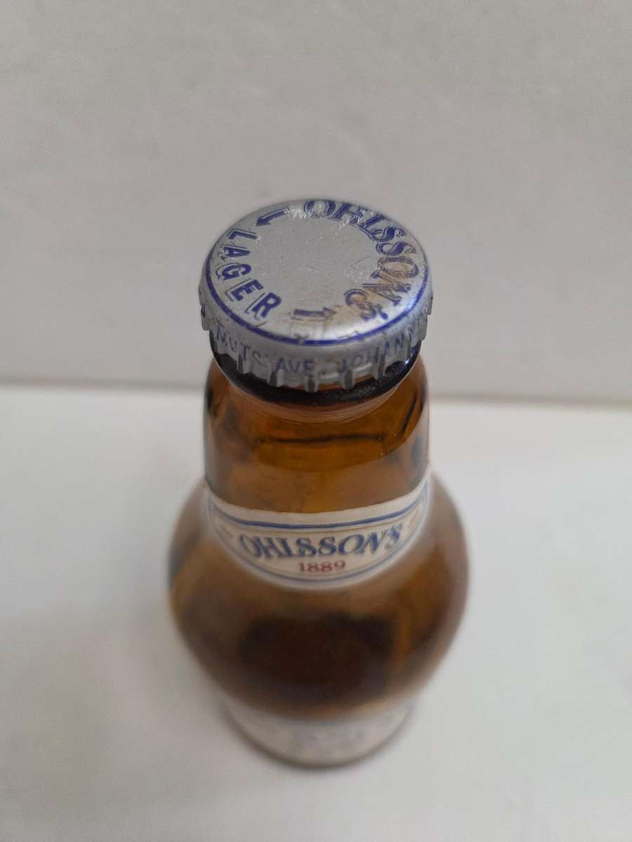 Vintage Ohlsson's Lager bottle with cap
