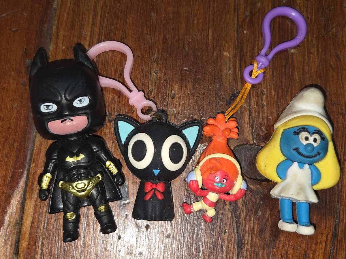 4 x Toy Figurines incl. Batman, Smurf, Troll, etc
