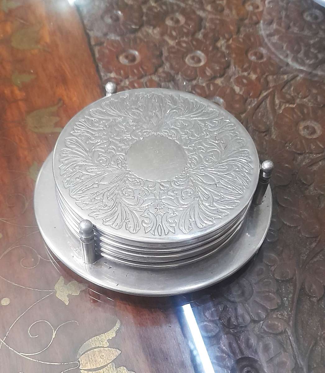 6 Beautiful Vintage Silver Coasters with holder. (see photos)