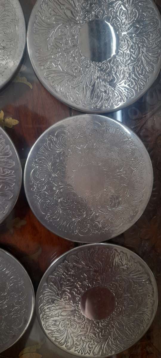 6 Beautiful Vintage Silver Coasters with holder. (see photos)