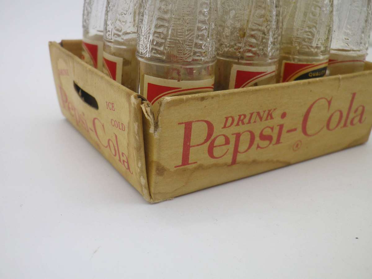 12 Vintage Miniature PEPSI bottles in paper crate. Contents