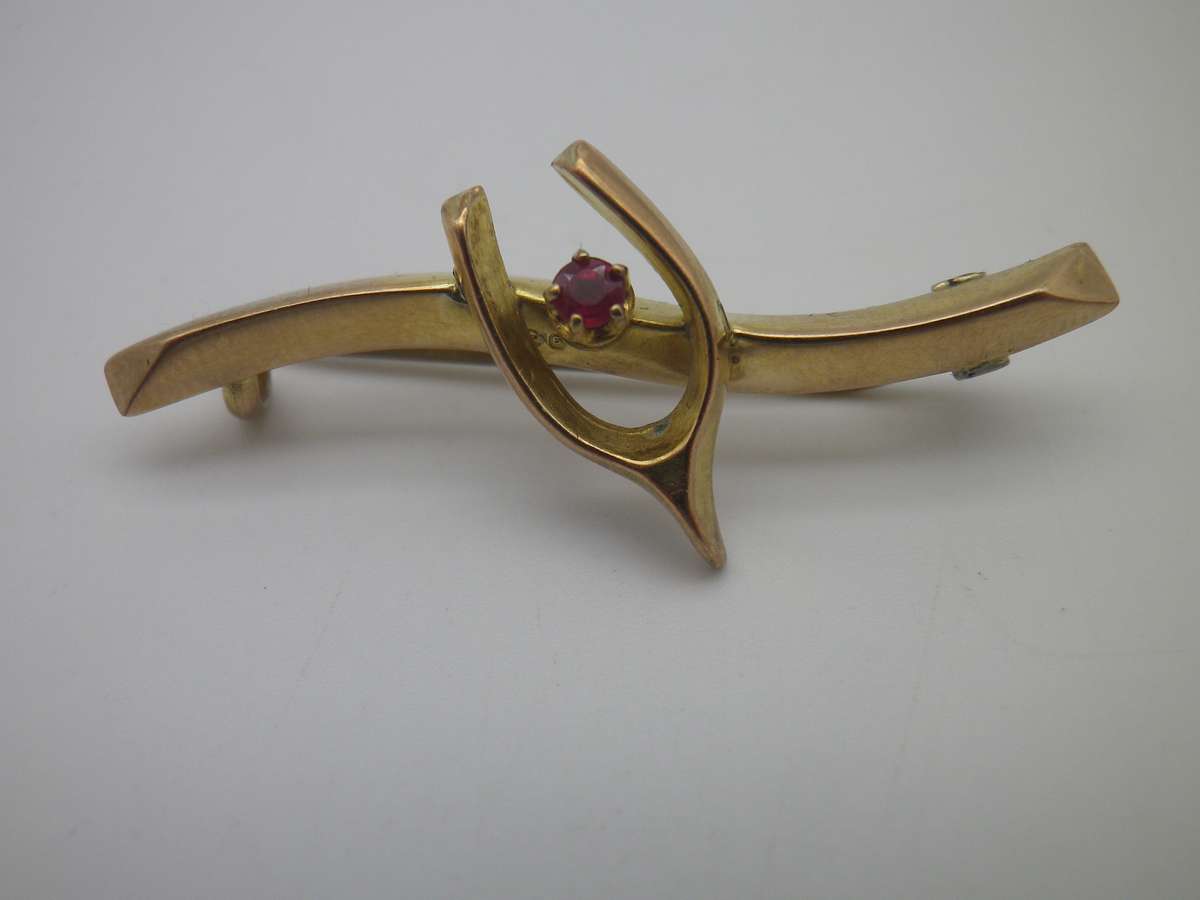 FOR DILA ONLY PLEASE. Hallmarked 9ct Gold & Ruby Lucky Wishbone brooch. Birmingham. 4cm 1.3g