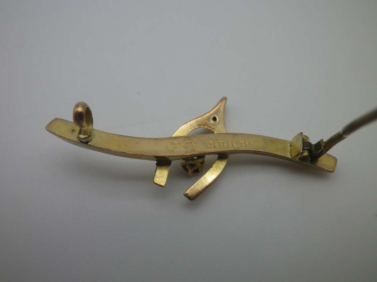 FOR DILA ONLY PLEASE. Hallmarked 9ct Gold & Ruby Lucky Wishbone brooch. Birmingham. 4cm 1.3g