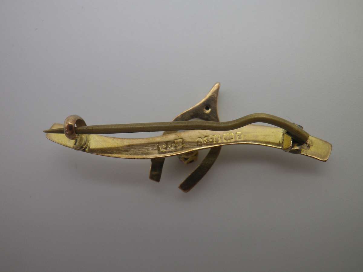 FOR DILA ONLY PLEASE. Hallmarked 9ct Gold & Ruby Lucky Wishbone brooch. Birmingham. 4cm 1.3g