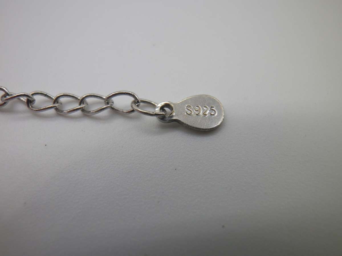 Unusual STERLING SILVER STANHOPE NECKLACE. Says "I love you" in many languages