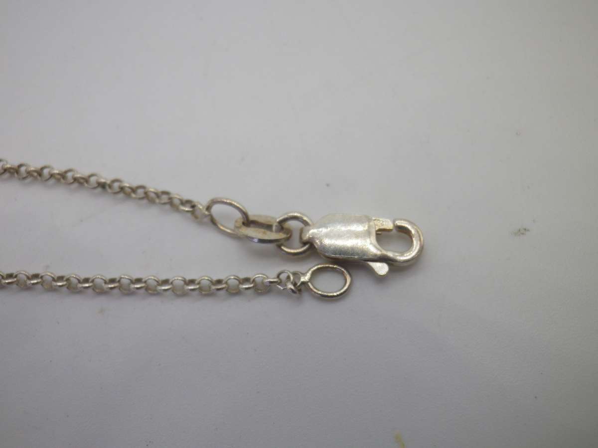 Vintage Sterling Silver CELTIC KNOT PENDANT with a little red stone, on silver Chain. 7.85g