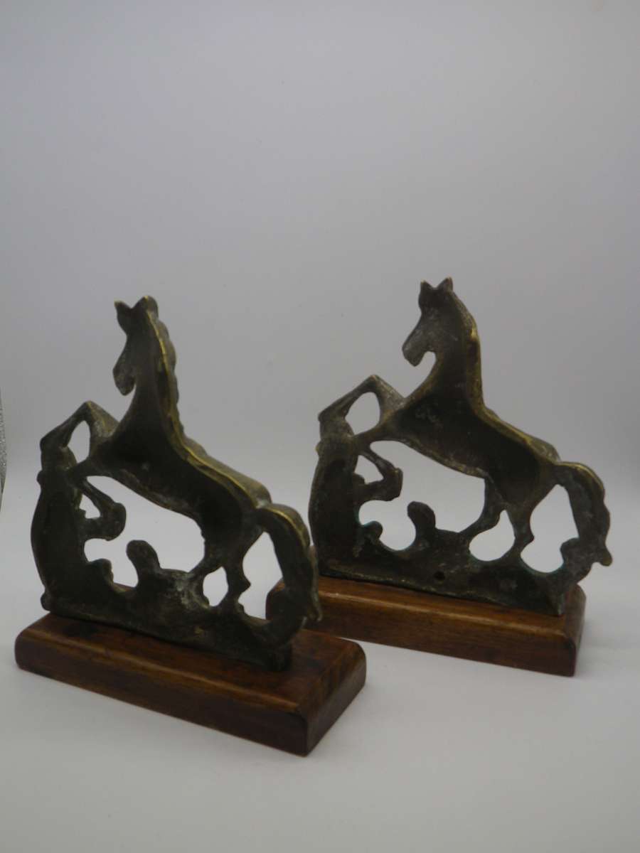 Pair Solid Cast brass Horse bookends on wooden bases. 17.cm x 15cm long