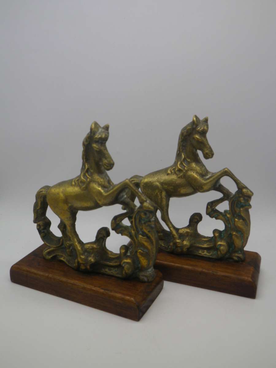 Pair Solid Cast brass Horse bookends on wooden bases. 17.cm x 15cm long