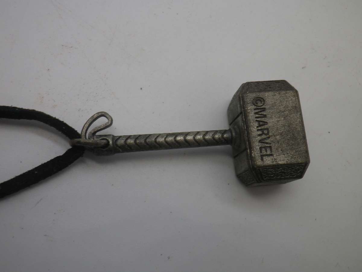Cool THOR'S Hammer pendant. copyright MARVEL. Silver color metal on material thong.