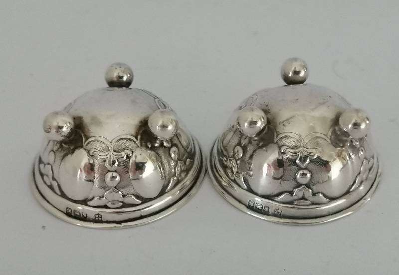 Pair Hallmarked Sterling Silver Repousse open salts. Sheffield 1904. 4.7cm x 2.5. 20.4g