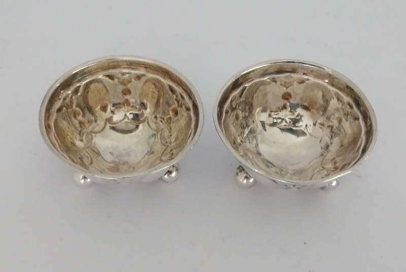 Pair Hallmarked Sterling Silver Repousse open salts. Sheffield 1904. 4.7cm x 2.5. 20.4g