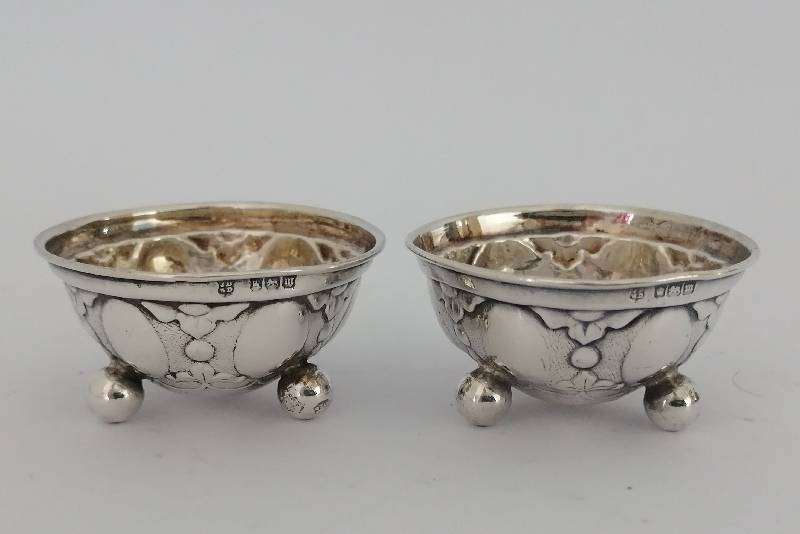 Pair Hallmarked Sterling Silver Repousse open salts. Sheffield 1904. 4.7cm x 2.5. 20.4g
