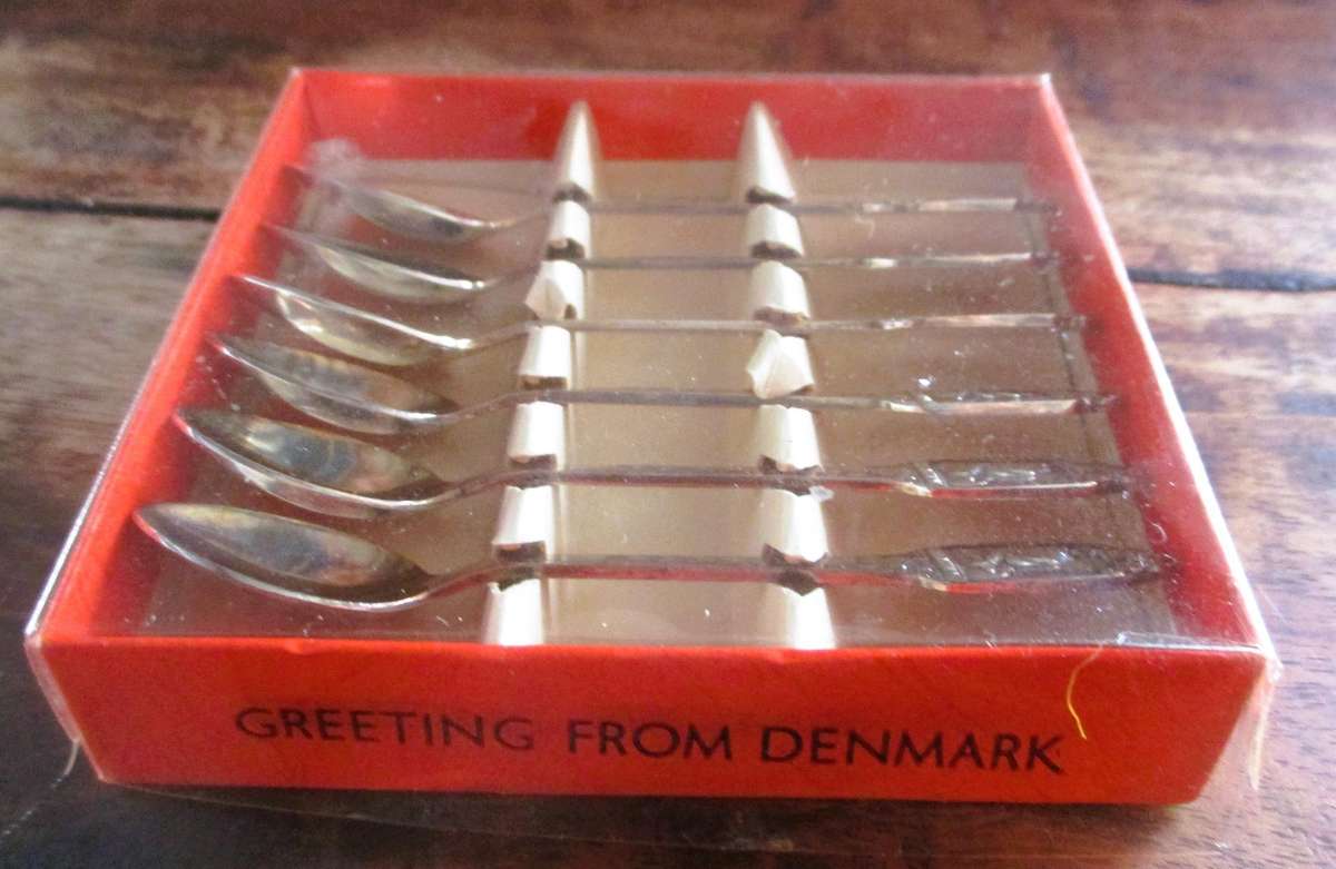 6 small Greetings from Denmark Silverplate Spoons in box.
