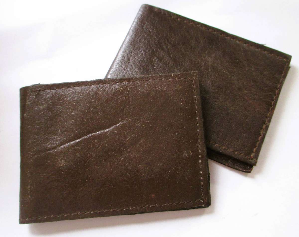 2 Vintage leather wallets features a bifold design with a zippered coin pocket, interior ID window.