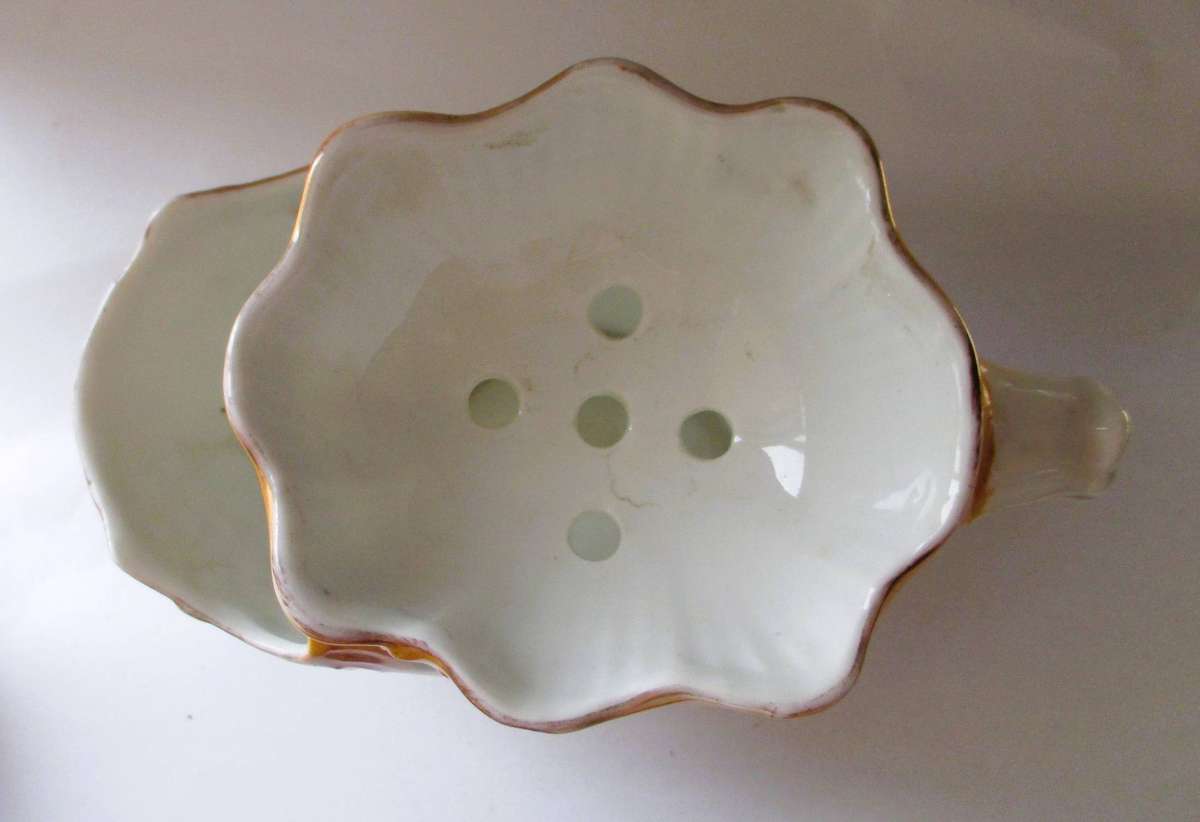 Antique Victorian porcelain shaving scuttle mug features a cream-colored interior distinct gold