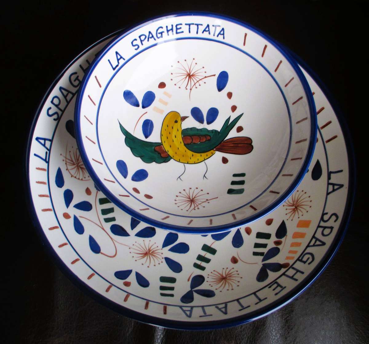 Set of three, large handpainted ceramic Spagetti server and two bowls. Fun servers.