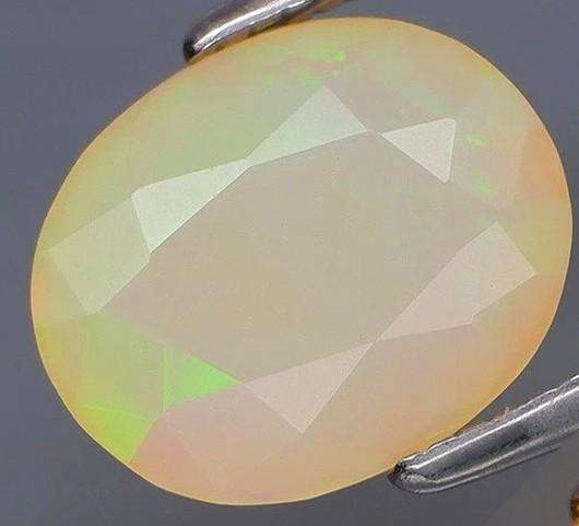 1.53Ct. Opal Fecetted Oval  Yellow & Rainbow Color Sparkling  Ethiopia Natural
