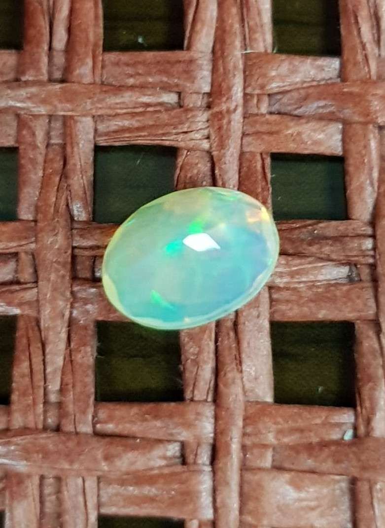 Opal 0.64Cts Oval Facetted 5x7mm Multi Colours Glittering Rainbow 3D! Ethiopian Natural