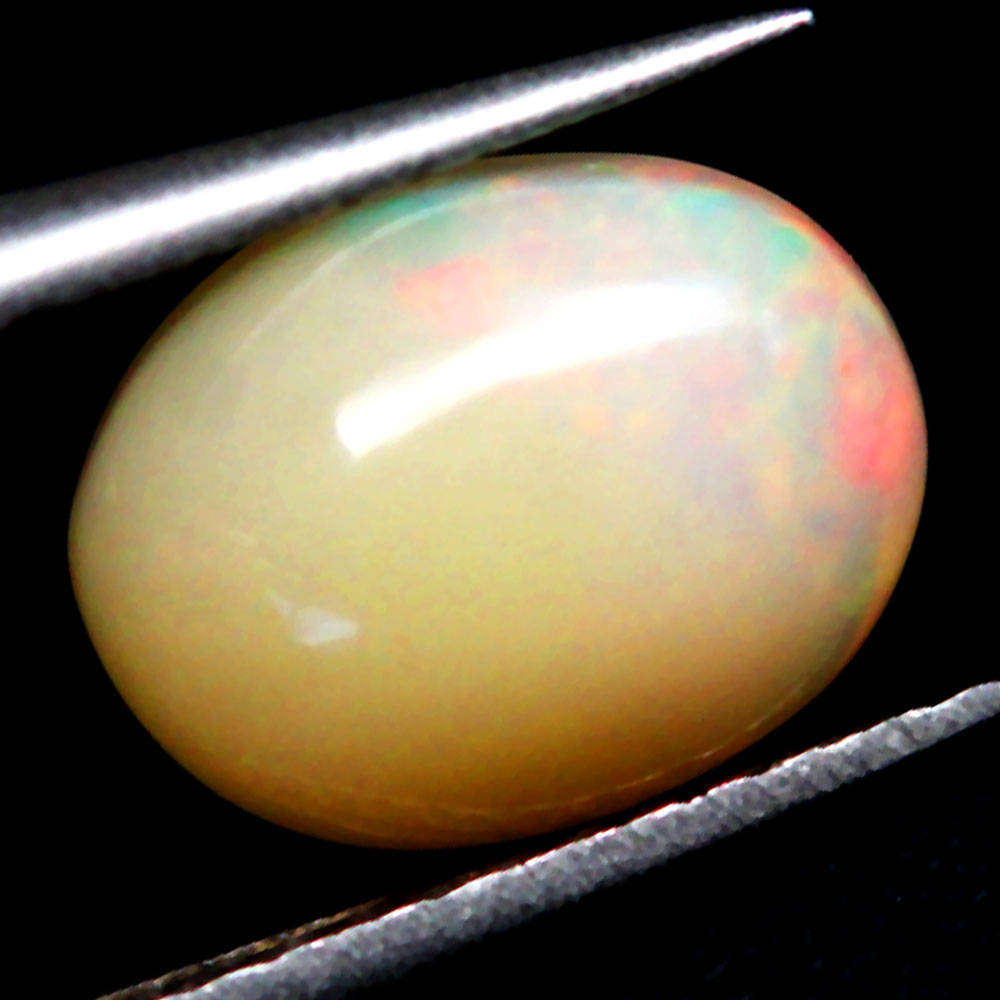 0.94Ct.  Opal Oval Cabochon Multi Colors Glittering Rainbow 3D Ethiopian Gemstone