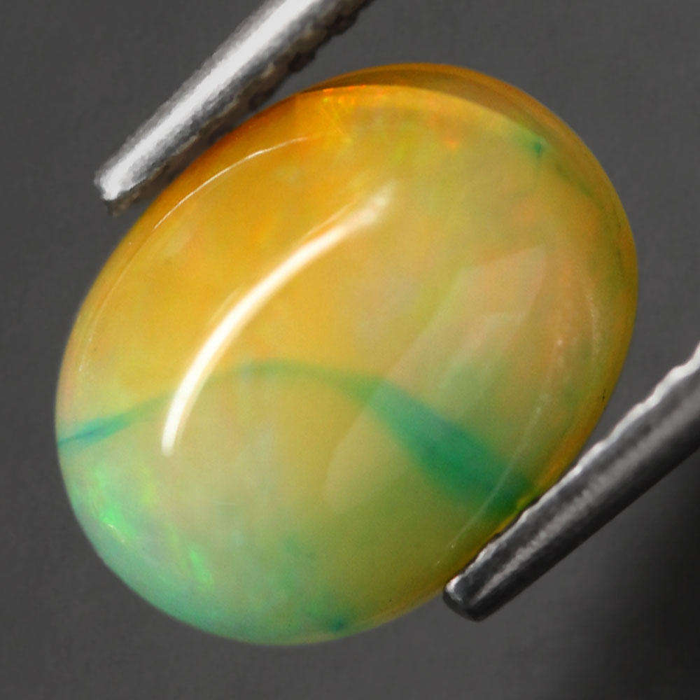 1.36Ct.  Opal Oval Cabochon Multi Colors Glittering Rainbow 3D Ethiopian Gemstone