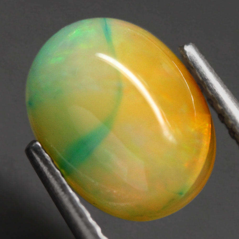 1.36Ct.  Opal Oval Cabochon Multi Colors Glittering Rainbow 3D Ethiopian Gemstone