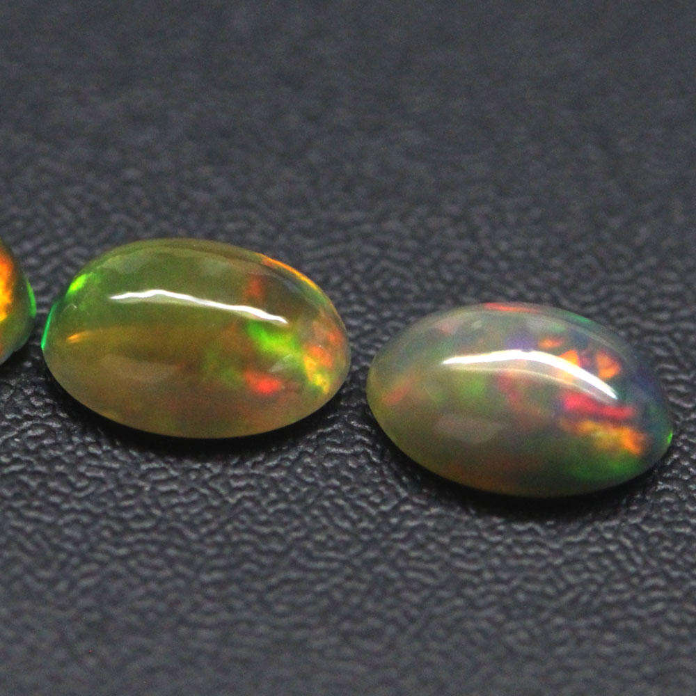 0.97Ct.  Opal Oval Cabochon 3 Pieces Multi Colors Glittering Rainbow 3D Ethiopian