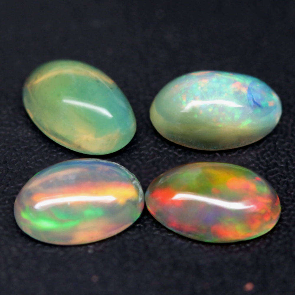 1.21Ct.Opal Oval Cabochon **4 Pieces**Multi Colors Glittering Rainbow 3D! Ethiopian  Natural