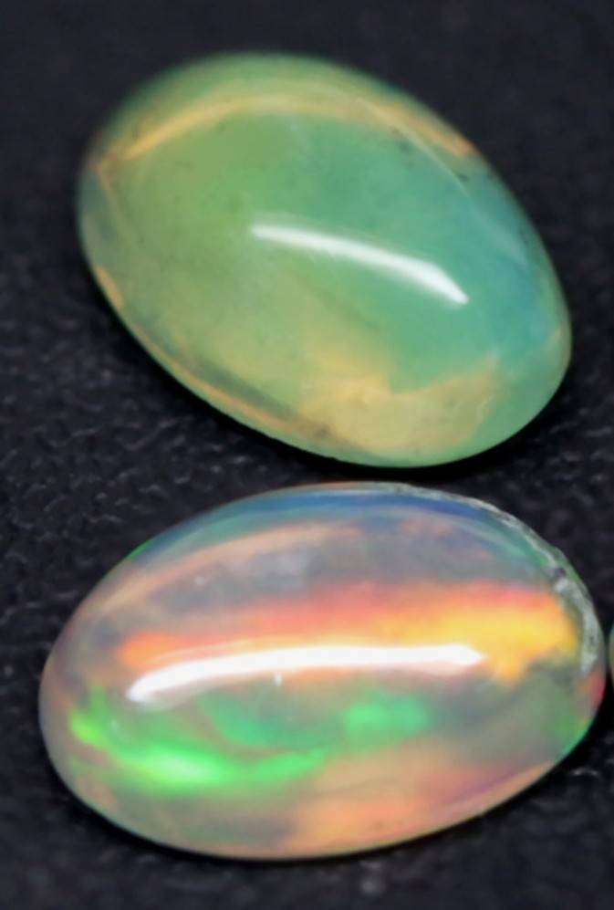 1.21Ct.Opal Oval Cabochon **4 Pieces**Multi Colors Glittering Rainbow 3D! Ethiopian  Natural