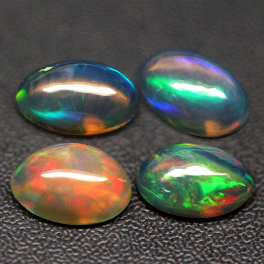1.19Ct.Opal Oval Cabochon **4 Pieces**Multi Colors Glittering Rainbow 3D! Ethiopian  Natural