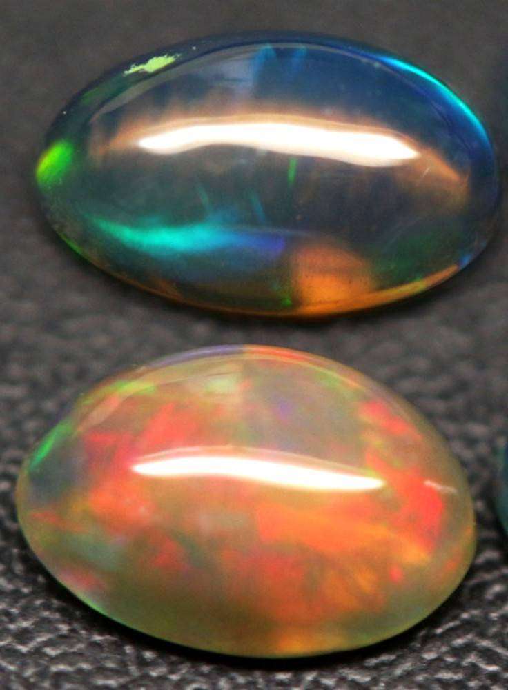 1.19Ct.Opal Oval Cabochon **4 Pieces**Multi Colors Glittering Rainbow 3D! Ethiopian  Natural